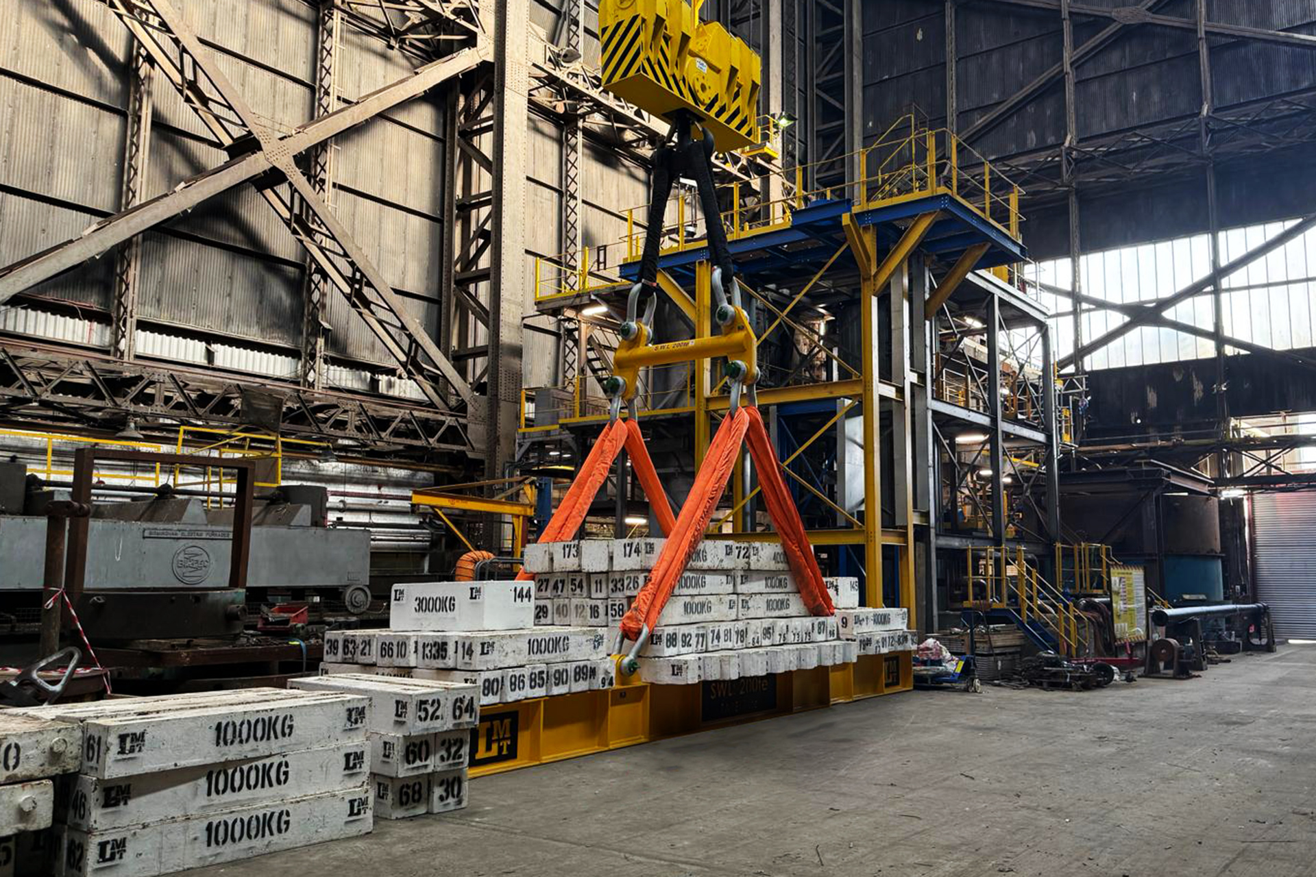 Test weight cradle hire — cast steel weights loaded onto a cradle system ready for delivery